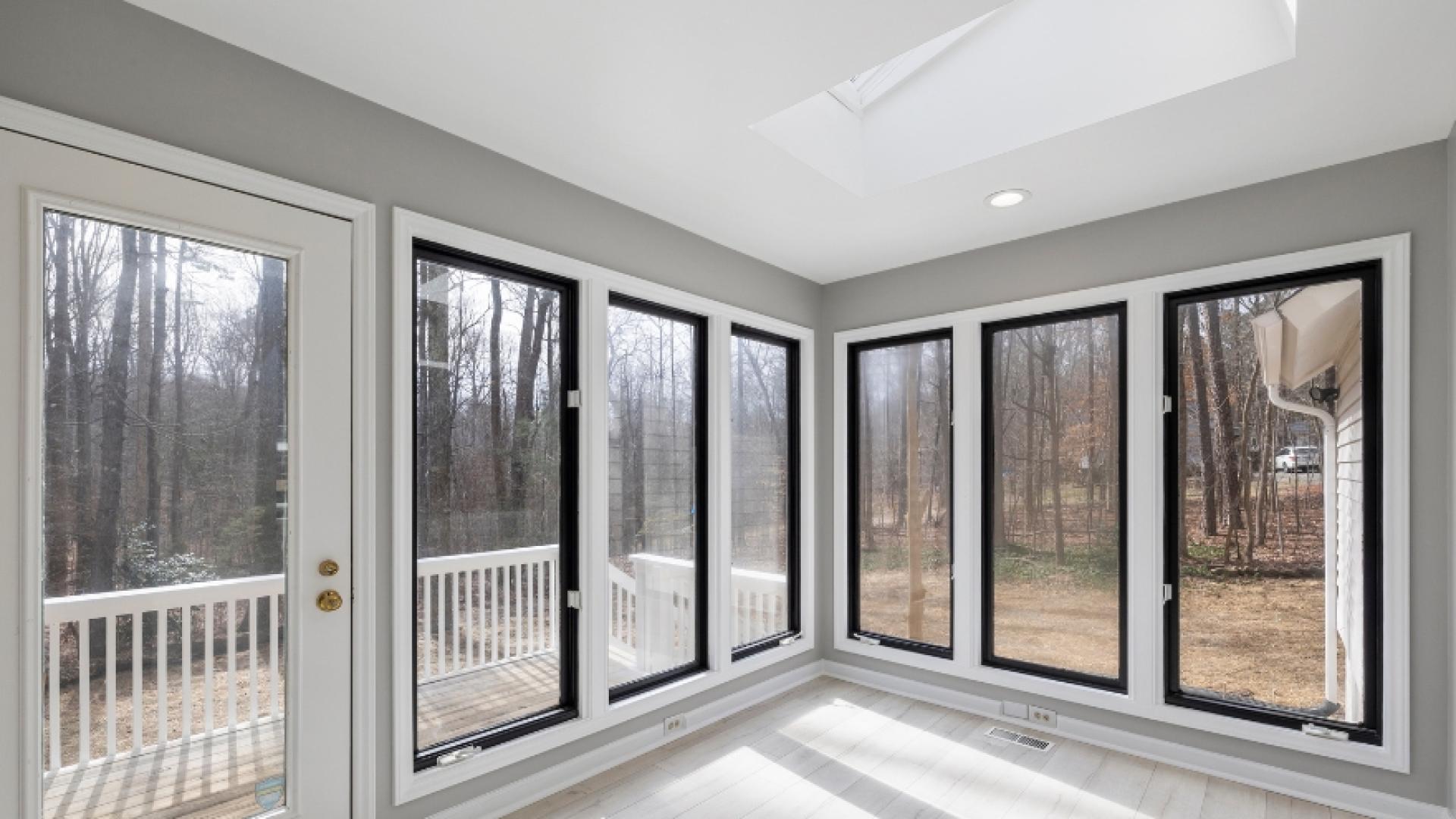 Sunroom with windows all along two walls